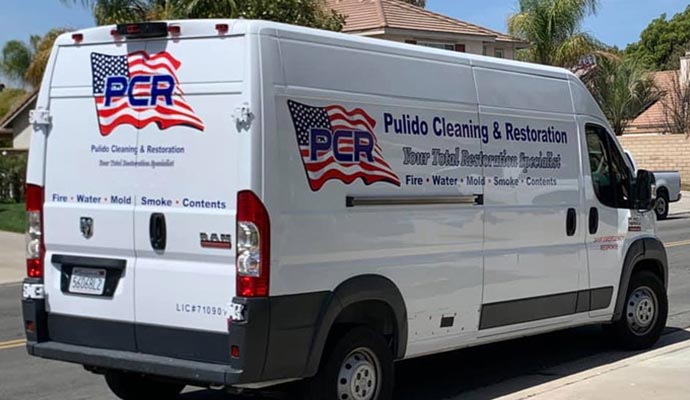 Pulido Cleanup & Restoration truck on the road