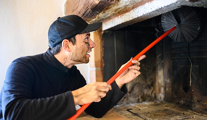 a professional cleaning a chimney