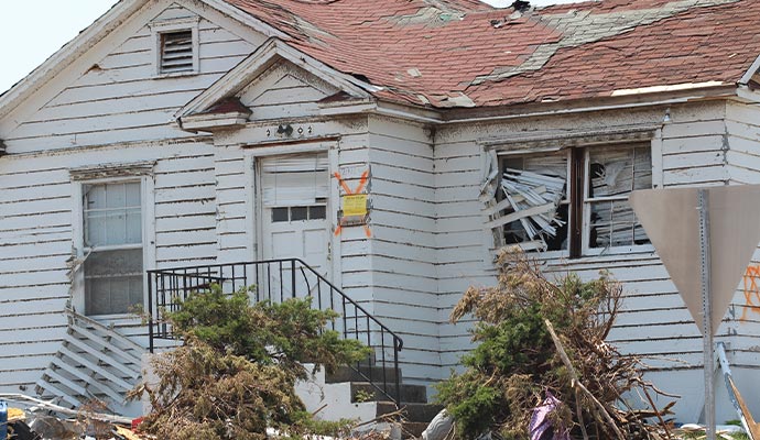 a house partially damaged by a storm