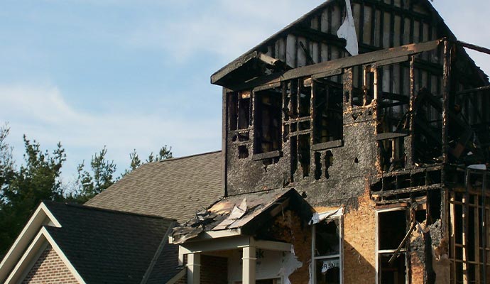 A house burned and structurally damaged