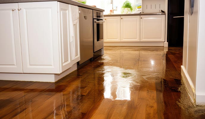 Flooded kitchen with wooden flooring