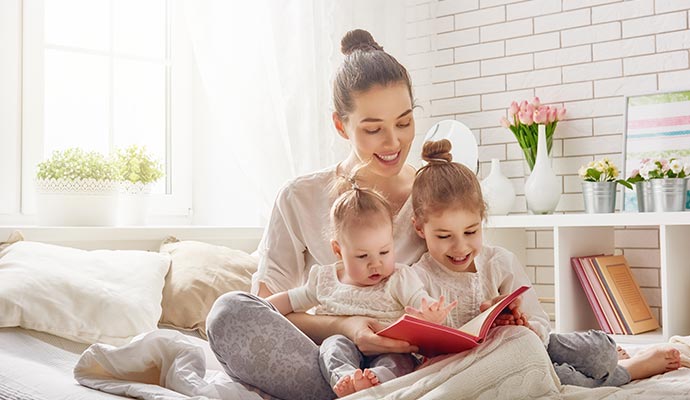 a woman and two child enjoying good indoor air quality in a room