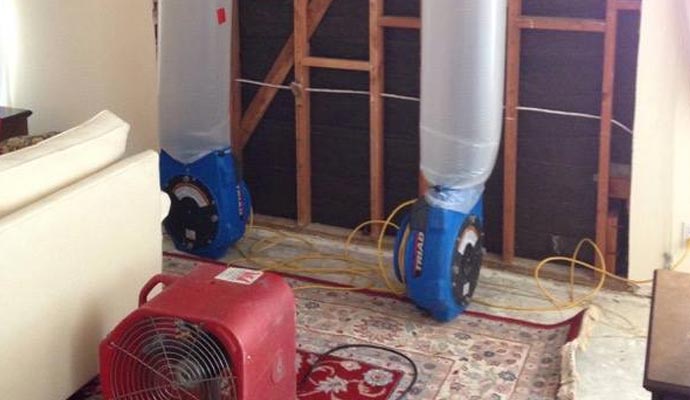 water damage restoration equipment set up on the floor