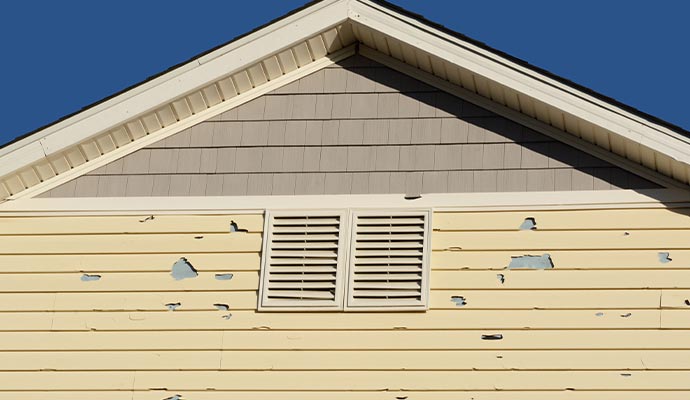 Hail damaged house