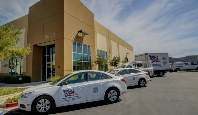 teampulido service vehicles in front of their office