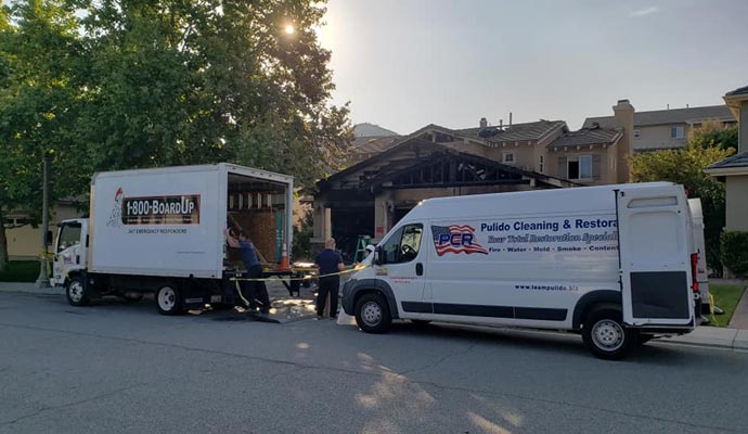 A restoration team with vehicles