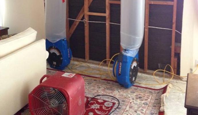 water damage restoration equipemnts on the floor